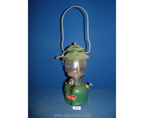 A Coleman pump action lantern Lamp, model 200A 700, 12 1/2" tall.