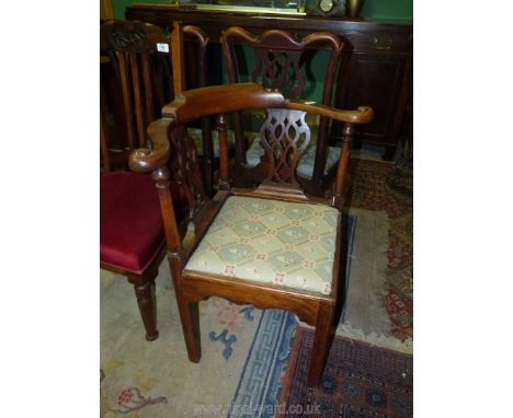 A Mahogany corner Elbow/Armchair of traditional Georgian design having elegant bowed arms, tapestry upholstered seat and stan
