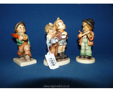 Three Goebel figures:  The Merry Widow, Little fiddler and Max and Maurice.
