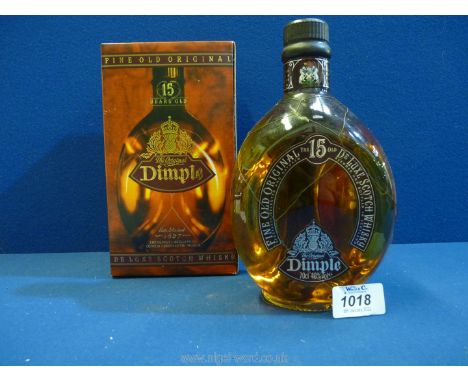 A boxed bottle of Dimple De Luxe Scotch Whisky, 15 years old.