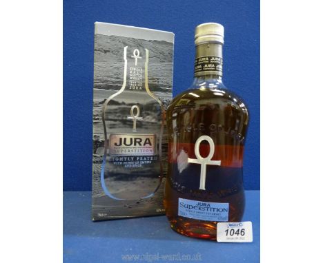 A boxed bottle of Jura Single Malt Scotch Whisky, lightly peated with hints of smoke and spice.