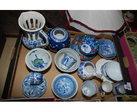 A box of blue and white oriental china including ginger jar, rice bowls, cups, puzzle jug, teapot (no lid), some a/f.