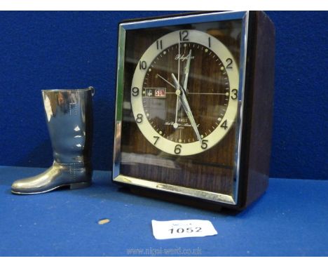 A Japanese 'Rhythm' mechanical alarm clock and a Jigger in the form of a riding boot.