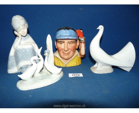 A Royal Doulton character jug of a Golfer modelled by David Biggs, 9'' tall and a Nao group of three ducks by a tree stump (c