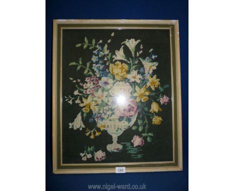 A framed tapestry of vase of flowers, 25'' x 20''.