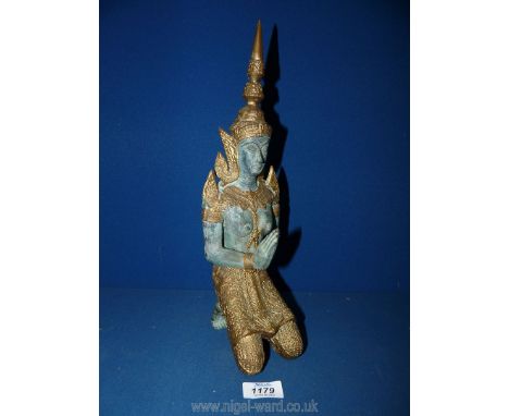 A bronzed sculpture of female temple keeper, made in Thailand, 14" tall.