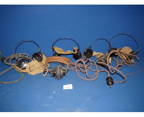 Five sets of headphones including one with leather lined head band and marked "Signal Corp, U.S. Army", some with cables and 