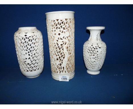 Three Blanc de Chine reticulated lamp bases with floral detail, 8" to 10" high