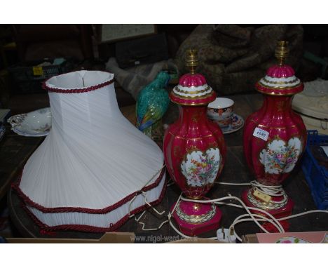 A pair of French Limoges table lamps, magenta and gold with floral central panel, with shades, 19" tall (without shade).