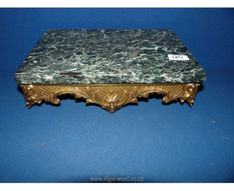 A well figured white veined dark green marble wall shelf, the cast brass finished supporting frame/bracket decorated with scr