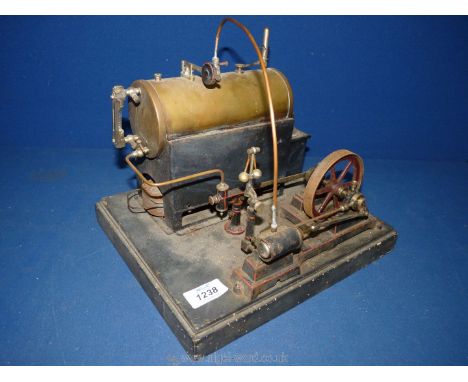 A well-engineered living steam model of a stationary mill engine having a single double-acting cylinder driving a 3 1/2" diam
