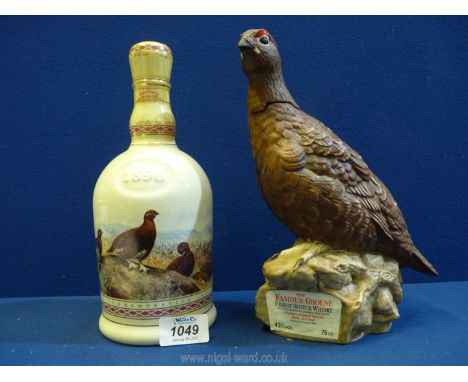 Two Famous Grouse Scotch Whisky decanters: one by Wade commemorating the centenary, the other by Royal Doulton in the form of