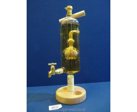 A novelty Highland Malt Scotch Whisky dispenser decanter with infuser of Malt within (missing two small glasses to the base).