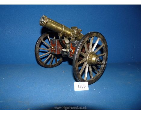 A large brass and metal model of a Gatling Gun with revolving barrel marked "Gatling USA 1888", 39 cm long x 24 cm wide x 19 