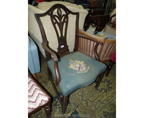 A lovely Mahogany framed Georgian broad seated Elbow Chair having intricately fretworked back splat, the tapestry seat with a