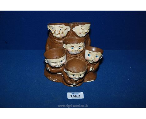 A Goebel multi egg cup in the form of monks.