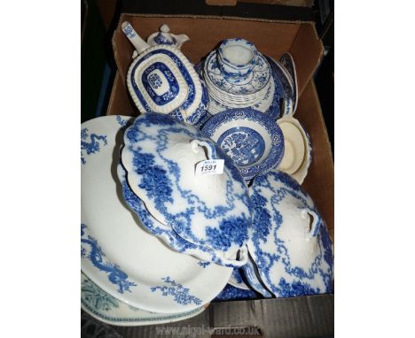 A good quantity of mixed blue and white china including vegetable dishes with lids, meat plate, dishes, saucers, teapot (a/f)