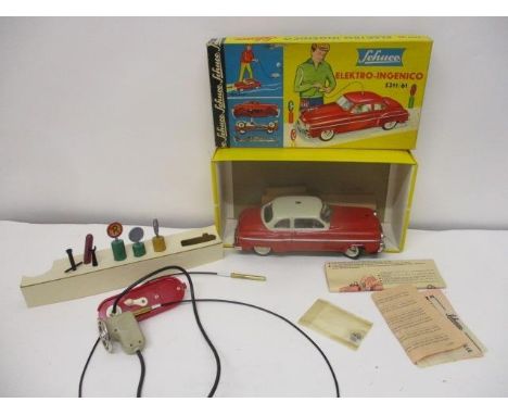 A Schuco 'Elektro-Ingenic 5311/61' toy car with tools, a hand control and instructions, boxed 