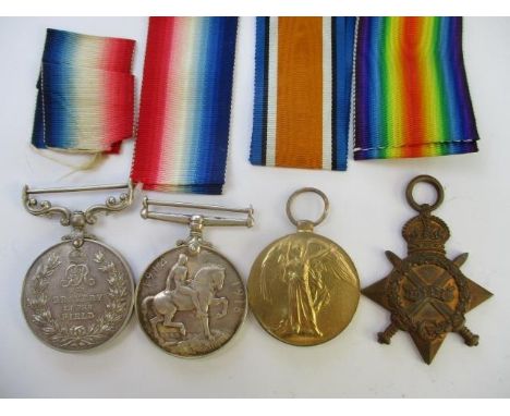 A group of four WW1 medals, a Victory, a British War, a 1914-15 Star and a Bravery In the Field, each inscribed 13210 L SJT E