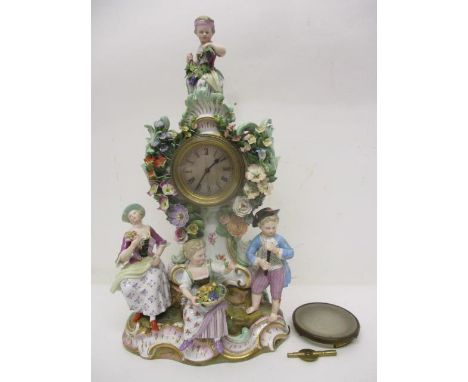 A late 19th century Meissen figural mantle clock, 'The Four Seasons', the case set with four figures, with scrolling leaves, 