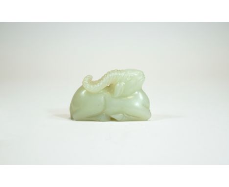 A Chinese Qing Dynasty White Jade Lamb. 85.4 grams. 1.5 x 2.25 Inches. 