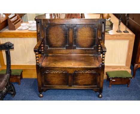 Oak Monks Bench with folding top and barley twist supports, hinged part with panelled front. 28 inches high, 19 inches deep a