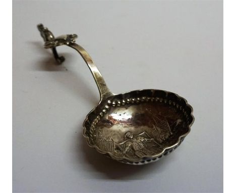 A Dutch Silver Spoon, circa 19th century, Decorated with embossed figures and cartouche, Hallmarks to back of stem, 12.5cm lo
