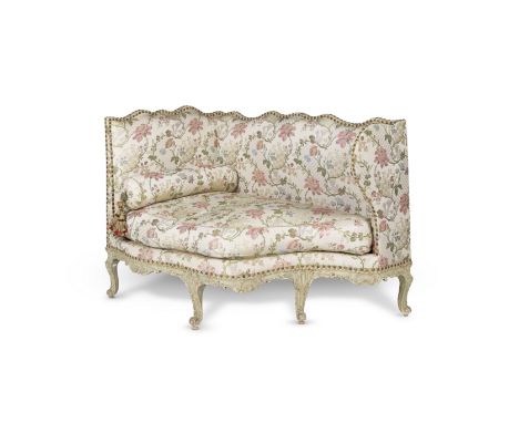 Canapé en ottoman, vers 1735A canapé en ottoman, circa 1735The waved back, eared sides and seat upholstered in floral pink an