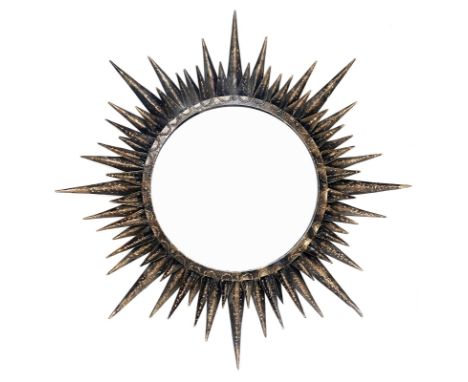 Sunburst mirror in lacquered and gilded metal, produced in France, in the style of Lene Vautrine. 70's. Wear and tear. Diamet