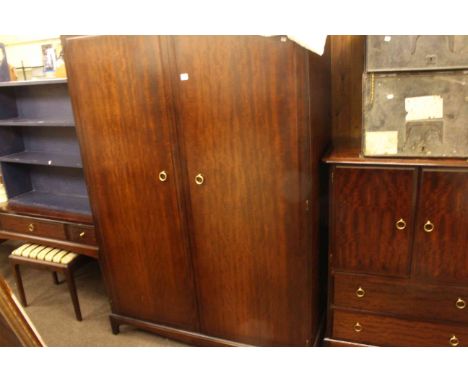 Four piece Stag Minstrel bedroom suite comprising double door wardrobe, triple mirror dressing table and stool and two drawer
