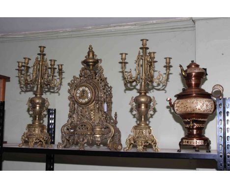 Ornate gilt metal three piece clock garniture and a copper samovar.