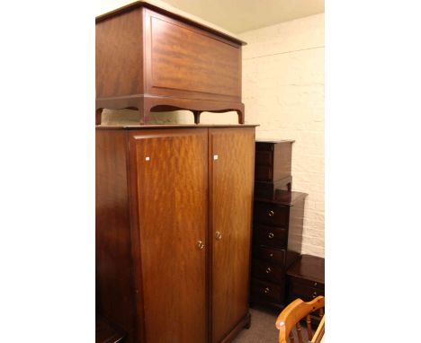 Eight piece Stag Minstrel bedroom suite comprising double door wardrobe, triple mirror dressing table and stool, seven drawer