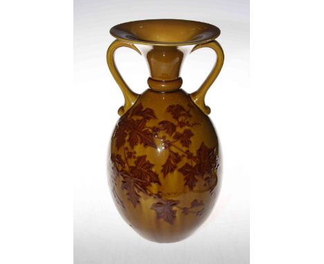 Linthorpe Pottery two handled vase decorated with leaf design on a mustard ground, impressed no. 1073 initialled F.B. Fred Br