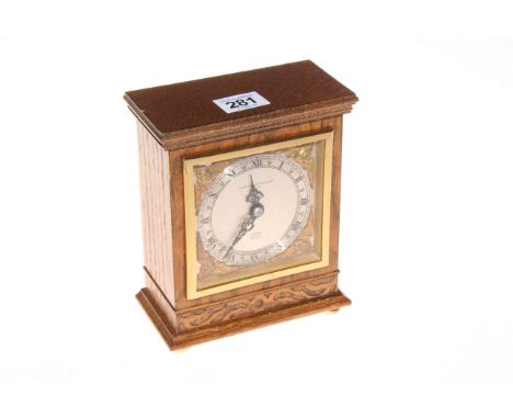 Elliott oak cased mantel clock, 17cm.
