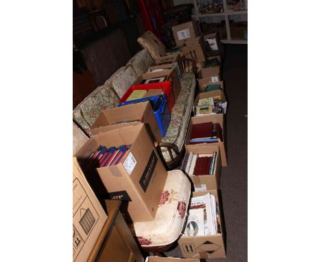 Twenty two boxes of books including military, trains, clock interest, topographical Britain.