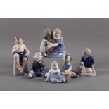 Six Royal Copenhagen figures of children, "Boy Eating Apple" (1744), "Boy with Bricks" (1830), "