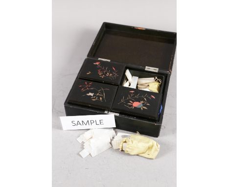 A collection of Chinese engraved mother-of-pearl counters in a four-division lacquered box 