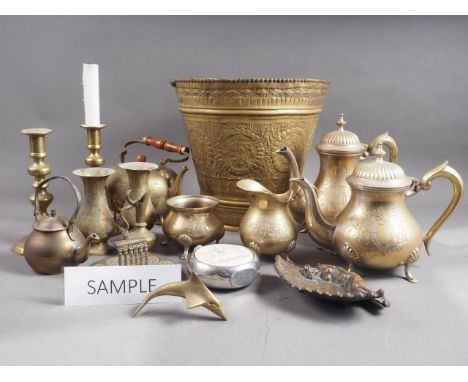 A quantity of brassware, including a pair of 19th century brass candlesticks, 8 1/2" high, a four-piece tea and coffee set, a