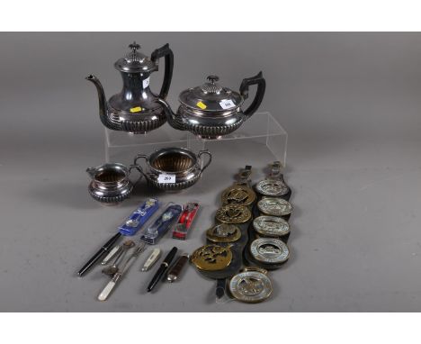 An EPBM four-piece tea and coffee set, a quantity of horse brasses, souvenir spoons, a silver and mother-of-pearl fruit knife