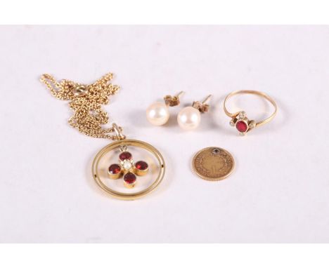 A yellow metal, garnet and seed pearl ring, size J, a similar pendant necklace, a pair of pearl ear studs and a miniature Uni