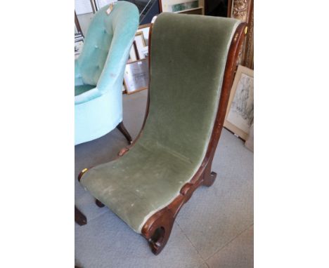 A late 19th century walnut showframe low seat nursing chair, on scroll supports, a late Victorian ebonised and gilt four-tier