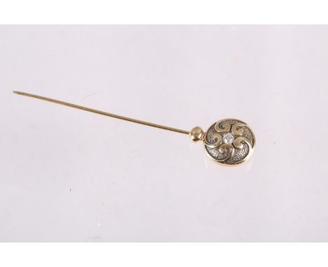 A yellow metal stick pin, set two CZ 