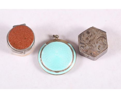 A light green guilloche enamel compact, a hexagonal silver pill box with engraved decoration and a white metal and adventurin