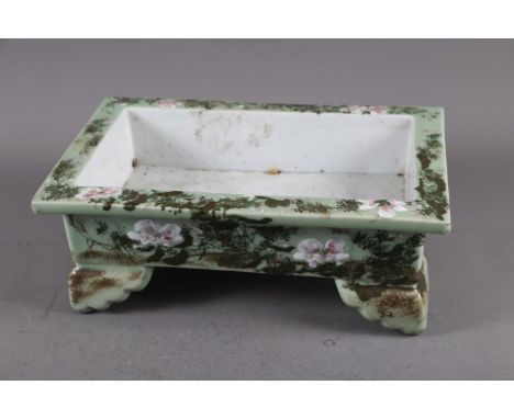 A Chinese celadon and floral glazed rectangular jardiniere, 15" wide x 10" deep x 4 1/2" high (one scroll foot stapled and gl