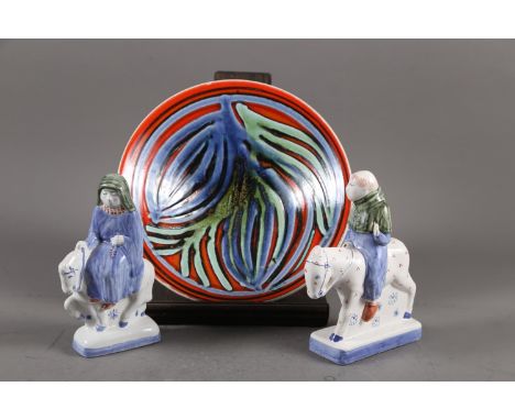 A Rye Pottery figure of a monk on horseback, 7 1/2" high, a similar figure of a nun and a Poole Pottery bowl, 10 1/2" dia 