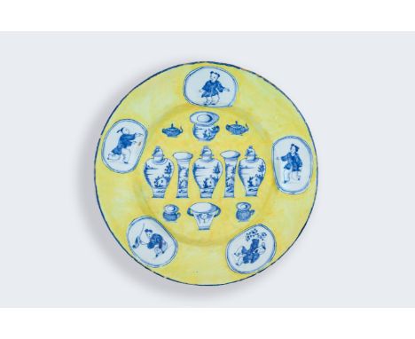 A very rare Dutch Delft yellow ground 'Sample' or 'Hundred antiquities' plate, 18th C.Dia.: 22,5 cm It is generally believed 