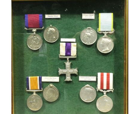 Mounted display of nine copy medals including Military Cross, Crimea, Waterloo and Indian Mutiny medals. P&amp;P Group 3 (£25