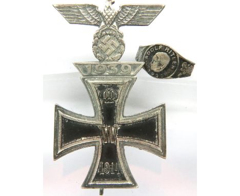 German WWI Iron Cross first class with WWII integral spange, tapering pin back, unmarked, with a white metal signet ring mark
