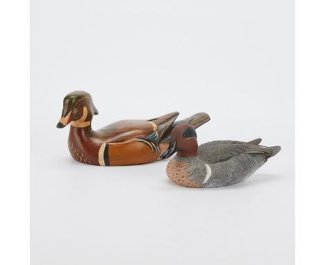 Grant Goltz (American, 20th/21st c). Group of two carved and painted wooden duck decoys. One green-winged teal, stamped, sign