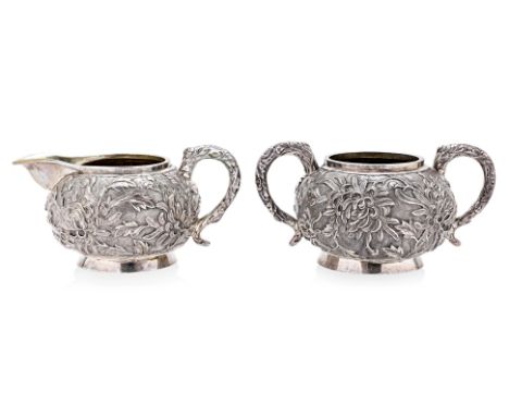 A CHINESE EXPORT SILVER MILK JUG AND SUGAR BOWL
Mark of Luen Wo, Shanghai, with gilt interior, both in repousse chrysanthemum